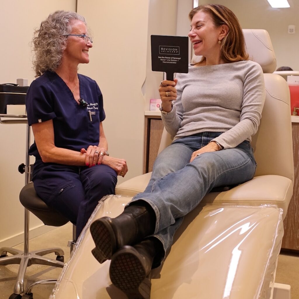 Dr. Alexander discussing options with a patient in a consultation.